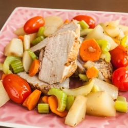 A prep cook removes a pork roast from the freezer