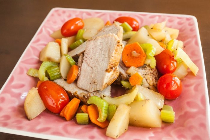 A prep cook removes a pork roast from the freezer